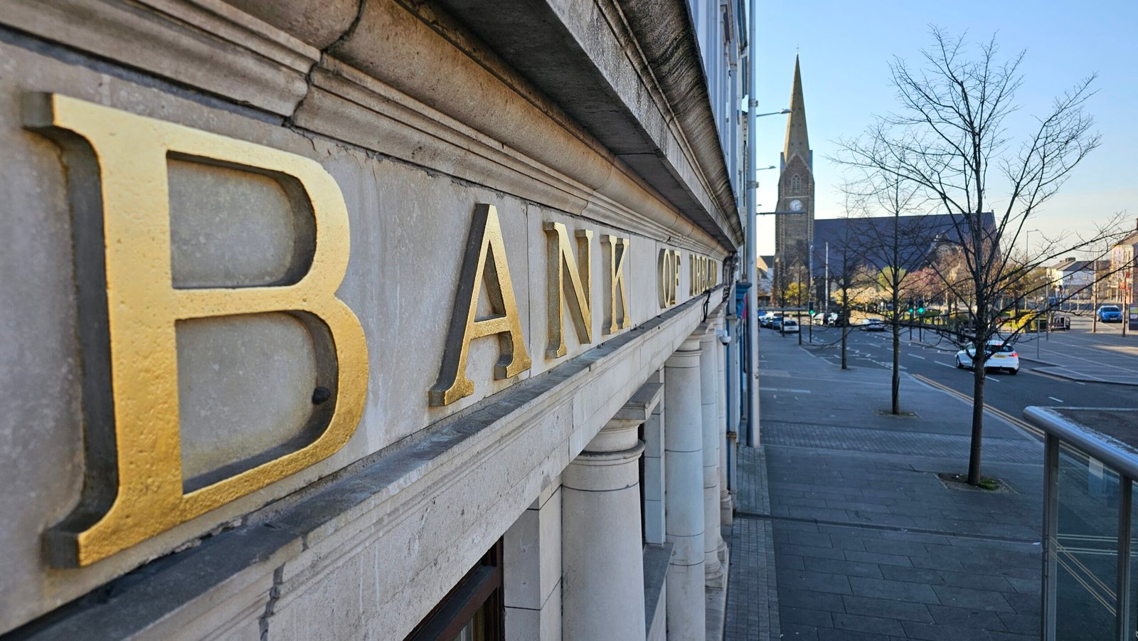 Detail of raised stone letter gilded in 23.5 carat gold by Joha Muñe at the Bank of Ireland in Lurgan.