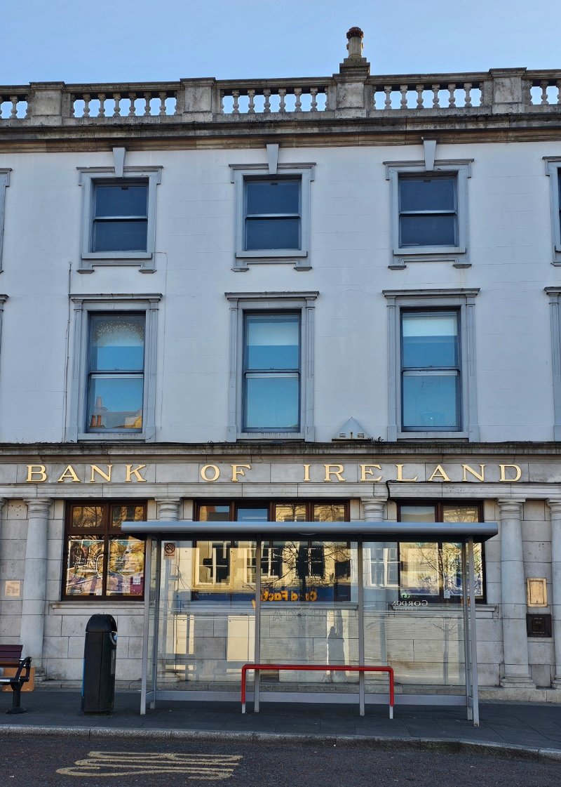 23.5 carat gold leaf gilded lettering on historic facade of Bank of Ireland in Lurgan, Northern Ireland.